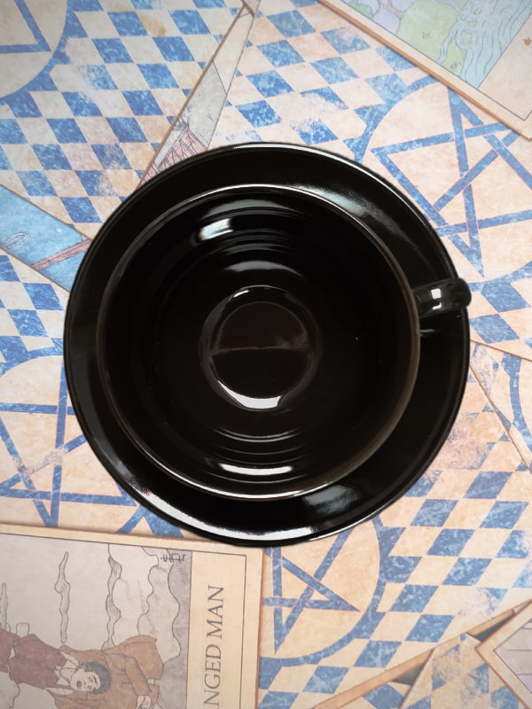 black glossy teacup from above